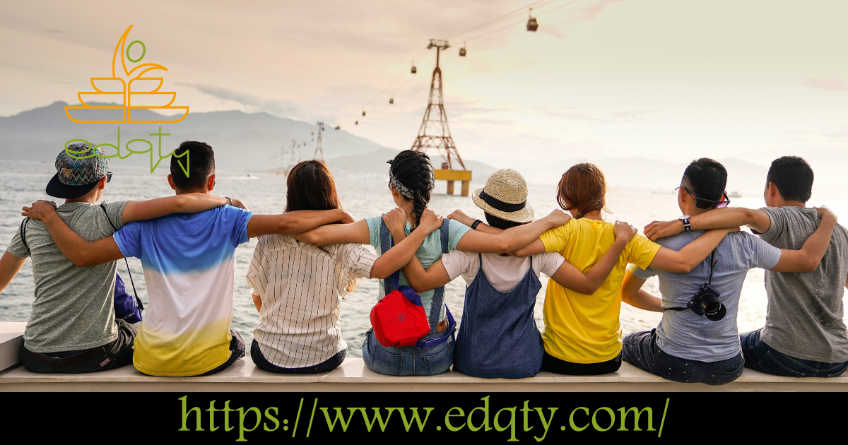 A diverse group of students embracing by the water symbolizing the friendships and shared experiences of life abroad